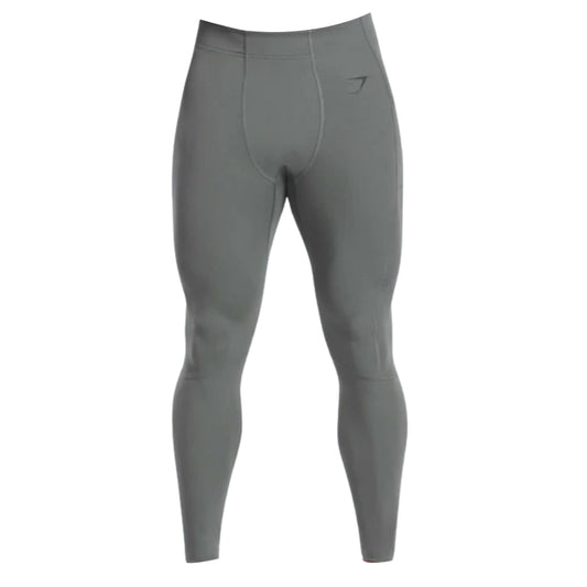 Gymshark Men's Control Baselayer Leggings in sleek gray, featuring a comfortable waistband and minimalist logo design.