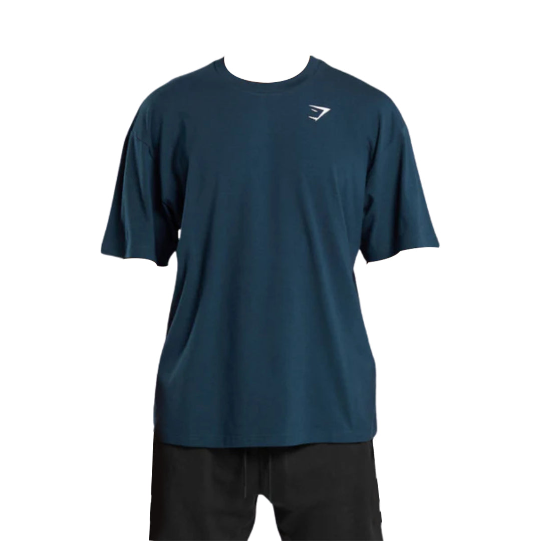 Men’s navy blue short-sleeve essential oversized t-shirt displayed without a model, featuring a simple logo on the chest.