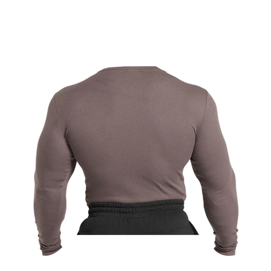 Close-up of a Gymshark men's brown, ribbed long-sleeve t-shirt on a torso form.