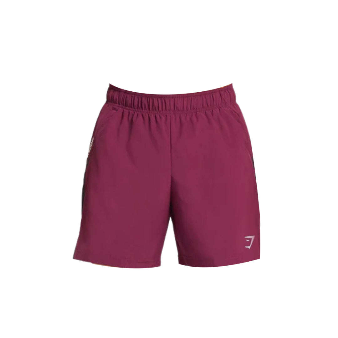 Maroon Gymshark Men's 7" Sport Shorts in a slim fit, featuring an elastic waistband and a subtle Gymshark logo on the lower right leg near the hem.