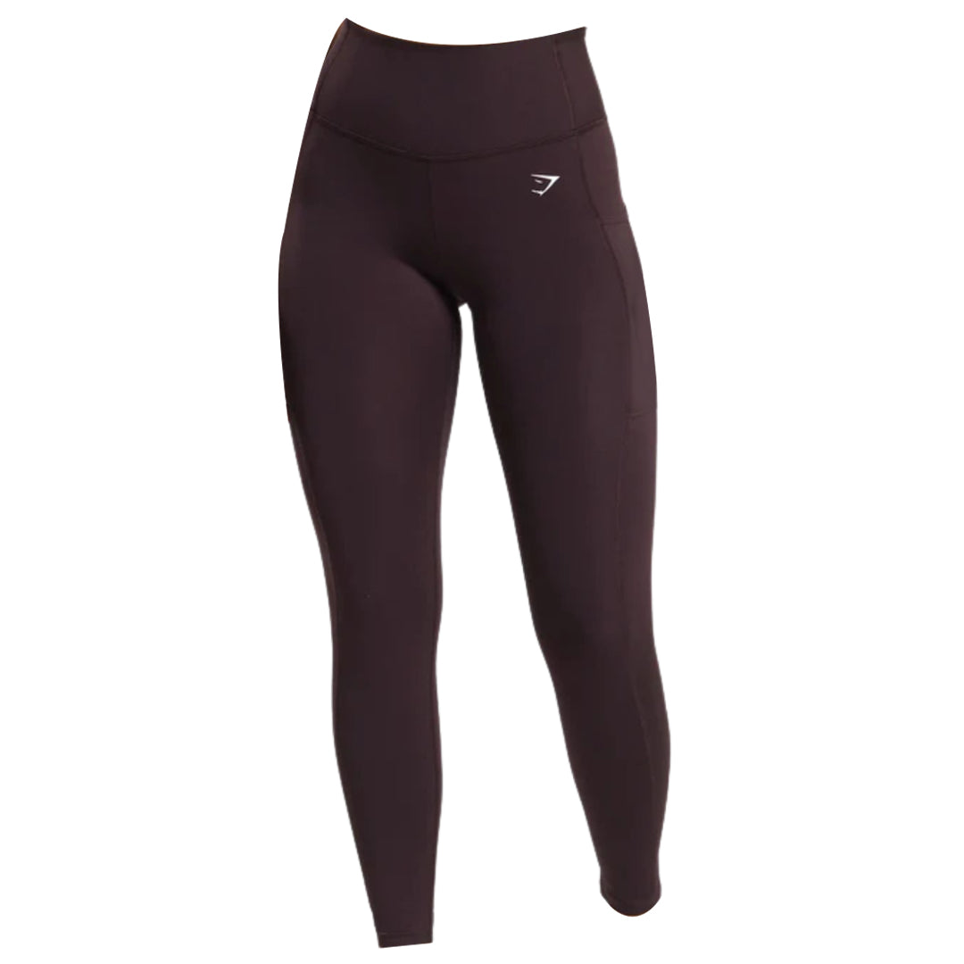 Gymshark pocket leggings in dark purple that have a high waistband and a white Gymshark logo on the left hip.
