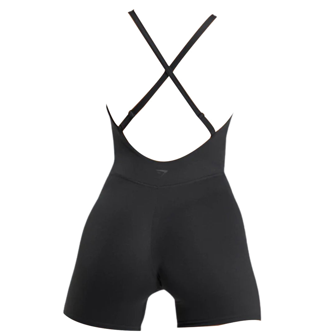 Gymshark Strappy All-in-One black athletic romper with crossback straps, featuring a fitted design and short legs, perfect for workouts or casual wear.