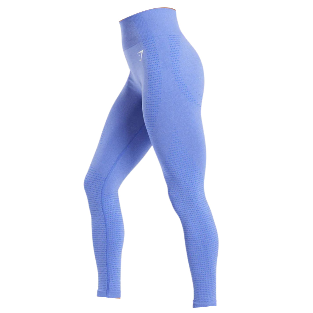 Side view of form-fitting blue Vital Seamless 2.0 leggings with a high waist and textured paneling, ideal for athletic activities.