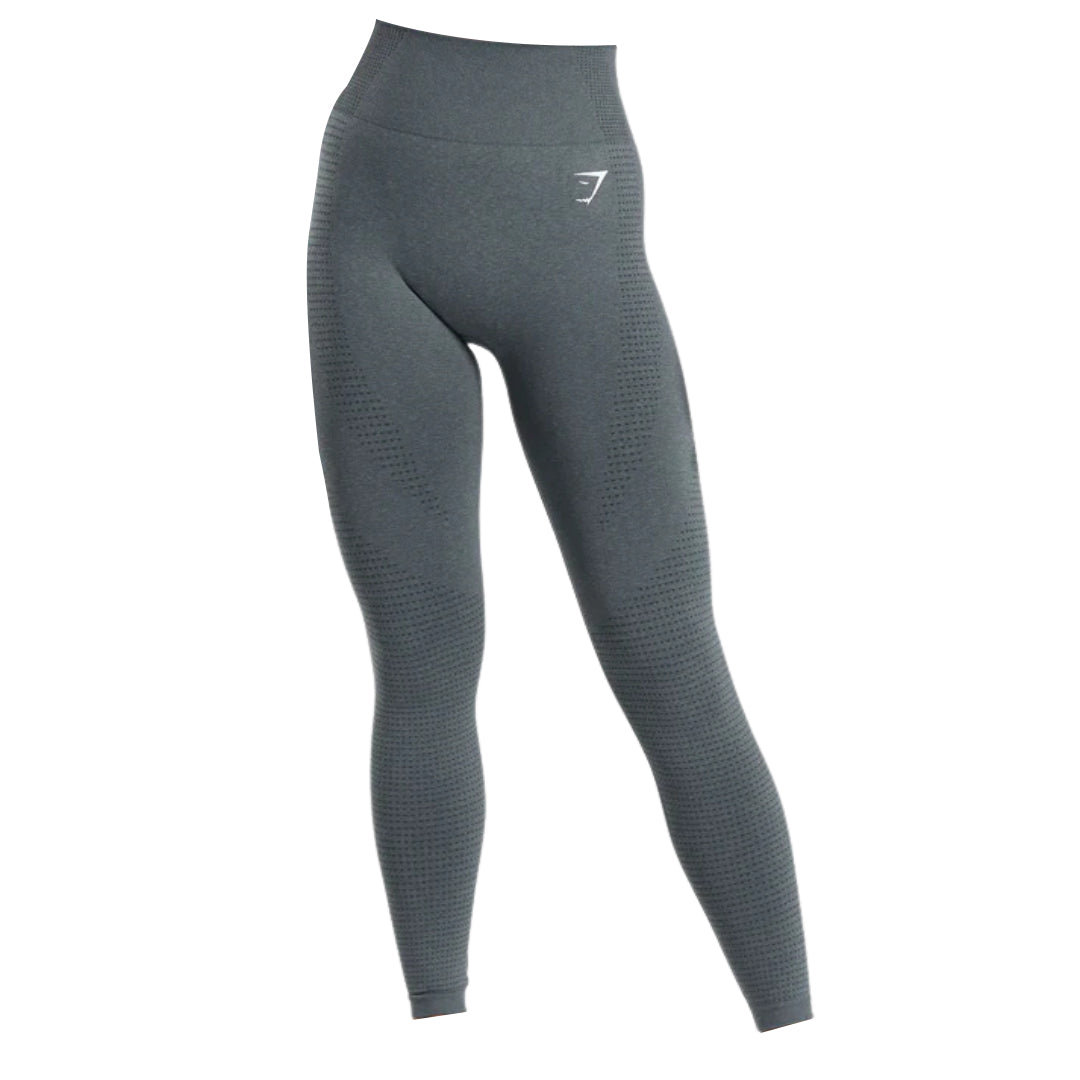High-waisted, dark gray leggings with textured detailing, ideal for athletic or casual wear. Featuring a subtle logo on the waistband.