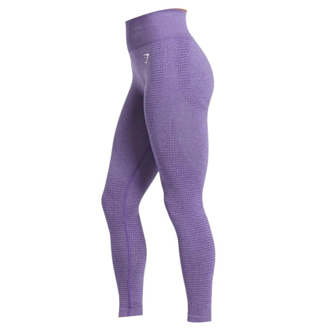 Side view of high-waisted purple leggings featuring textured patterns and a snug fit, ideal for exercise or casual wear.
