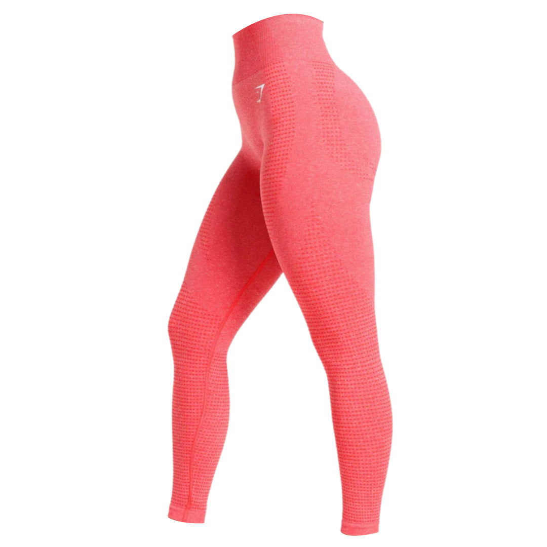 High-waisted, form-fitting leggings in vibrant coral, featuring textured panels for added style and comfort during workouts.