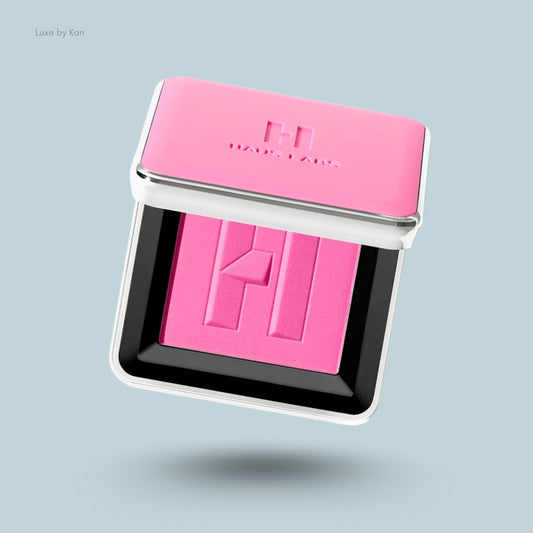 Open pink compact of Haus Labs Color Fuse talc-free powder blush, showing the logo on the blush.