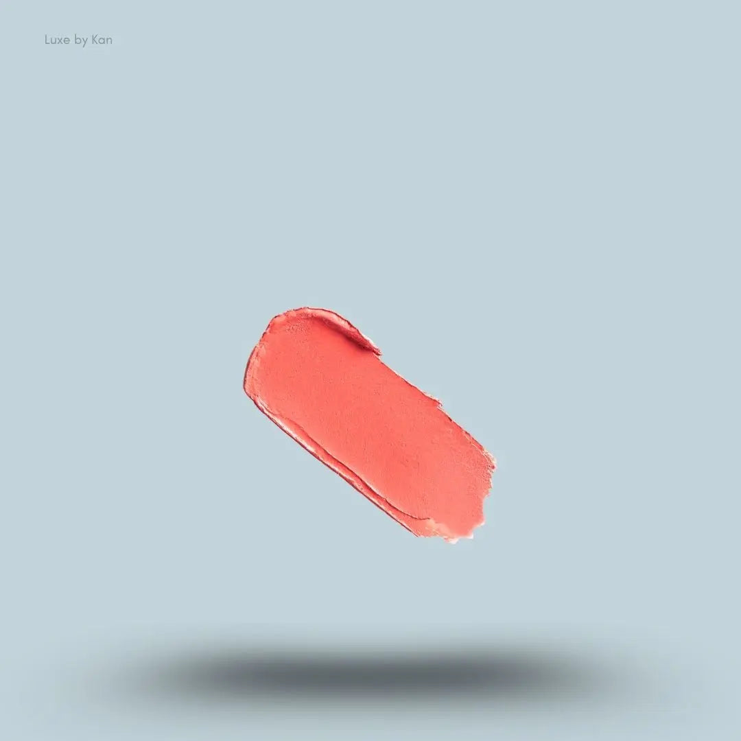 Kylie Cosmetics Powder Blush Stick Cream Blush swatch on blue background — Luxe by Kan India