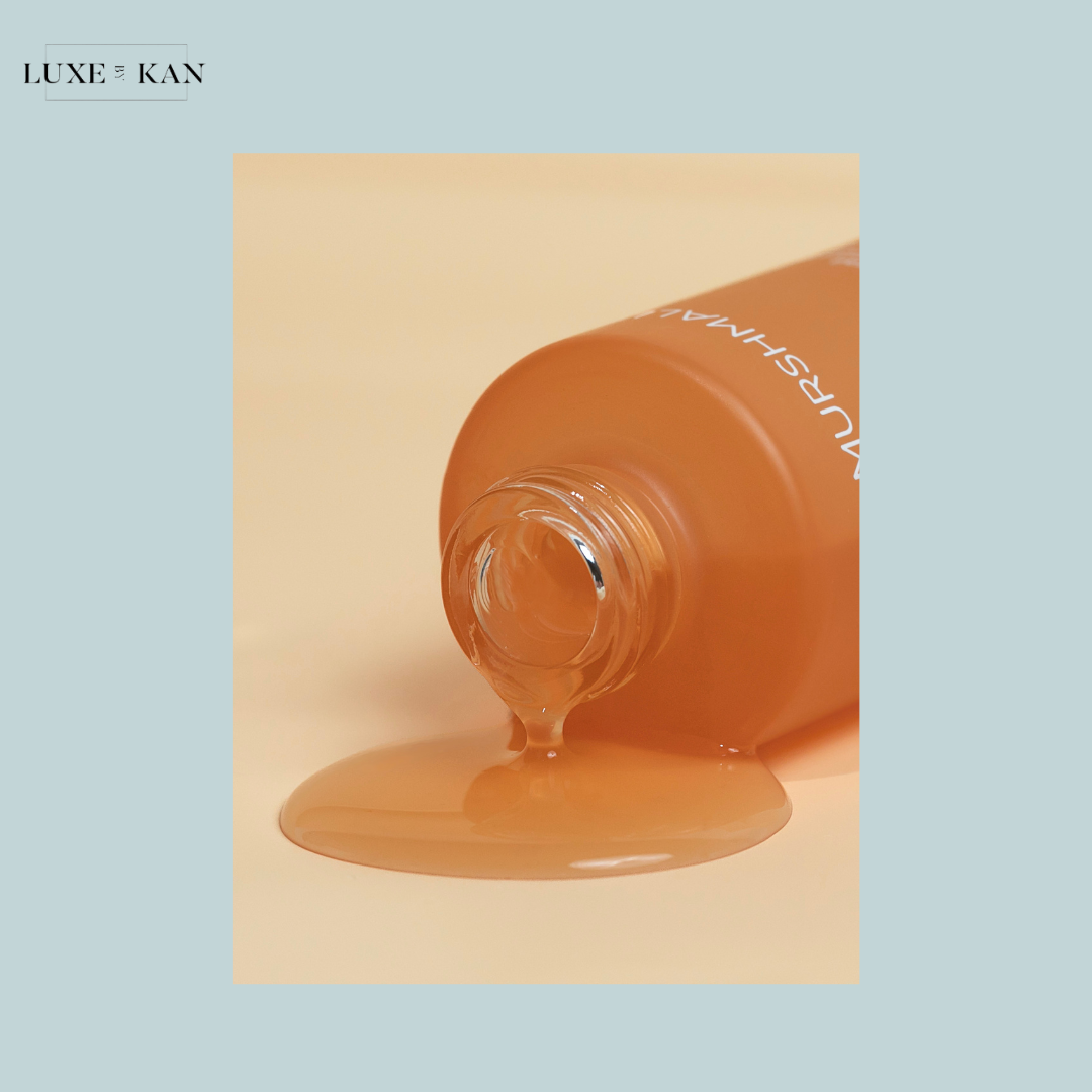Murshmallow Holy Grail Vit C Serum Concentrate spilled bottle of luxurious orange-colored serum.