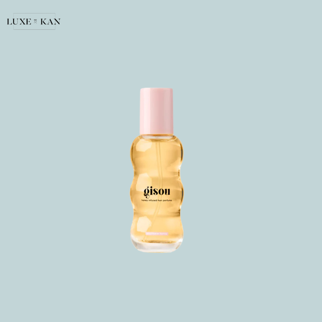 Gisou honey-infused hair perfume with a soft pink cap,