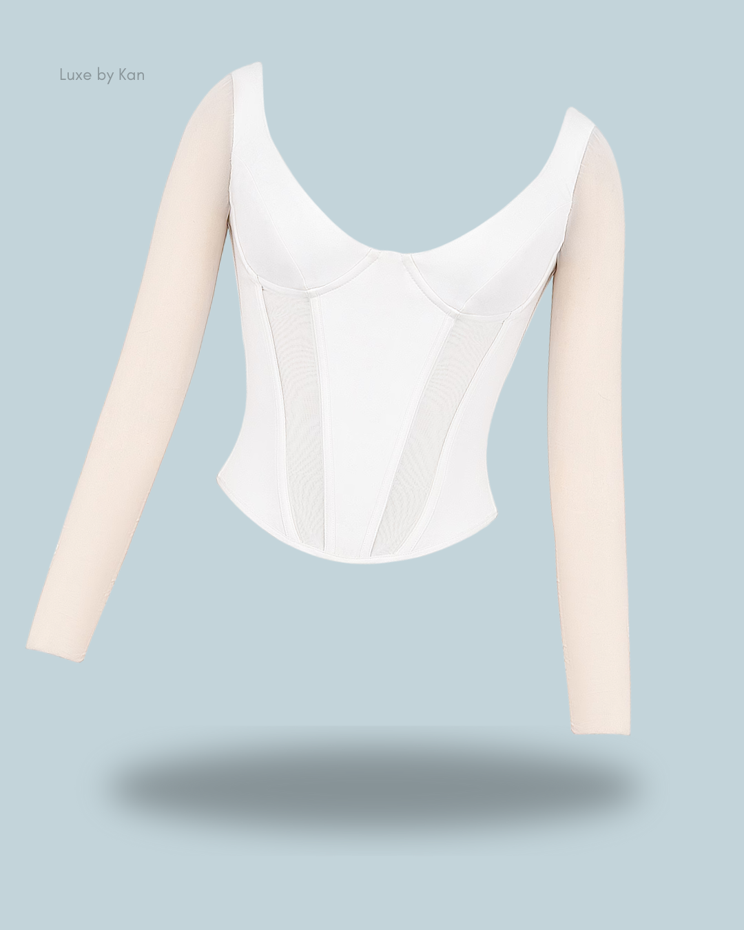 White araminta corset top with beige long sleeves, showcasing a sleek design.
