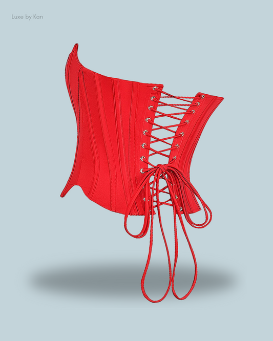 House of CB Genevieve scarlet satin lace back corset in red, featuring lace-up back detail and structured boning on plain background.