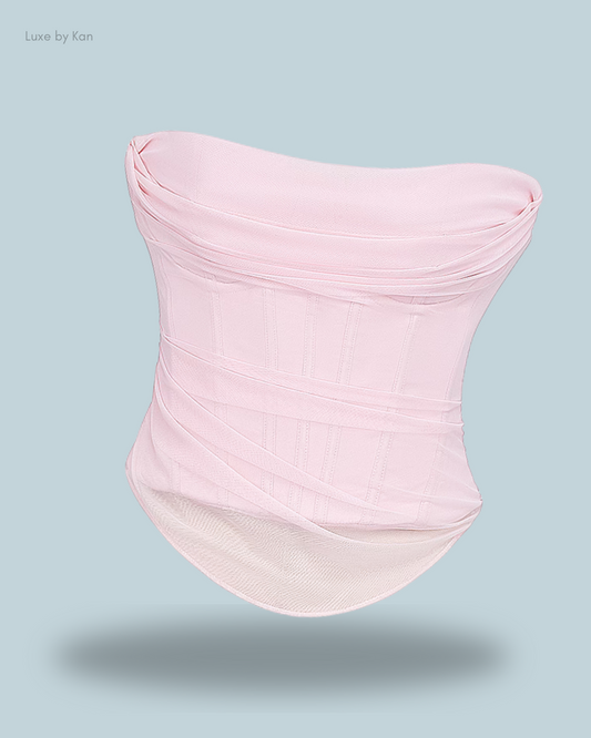 House of CB Georgie strapless corset in ballerina pink with sheer mesh layers, tailored fit, and structured boning on a clean backdrop.