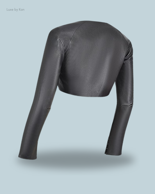 Back view of House of CB Ione black vegan leather cropped top featuring long sleeves and smooth texture.