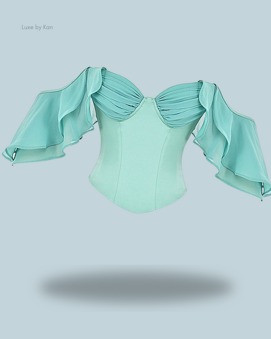 House of CB Isabella jade corset top featuring pleated shoulders, ruffle detailing, and flowing statement sleeves.