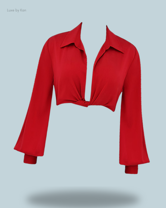 House of CB Laraine cherry silk blouson top featuring a deep V-neckline, knotted front, and flowing bell sleeves.