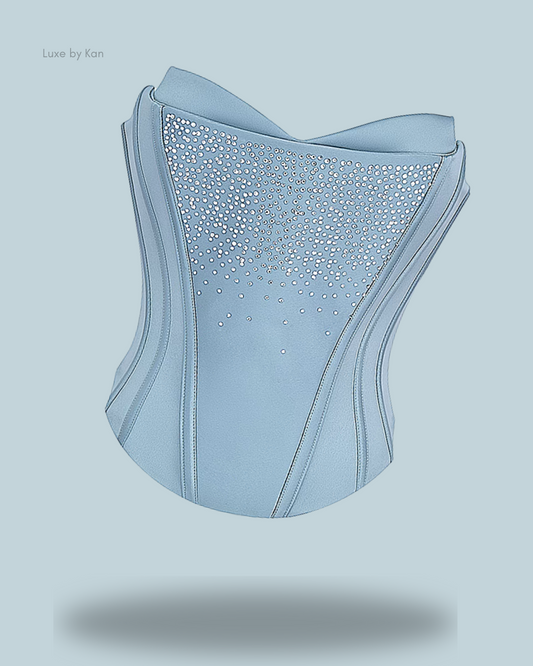 A stylish light blue House of CB Nastassia Cool Blue embellished satin corset, adorned with sparkling rhinestones and featuring elegant lines with a modern design.