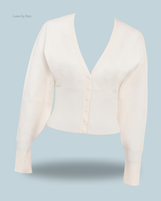 House of CB Noor off-white knitted cardigan featuring a deep V-neckline and ribbed hems for a refined, cozy look.
