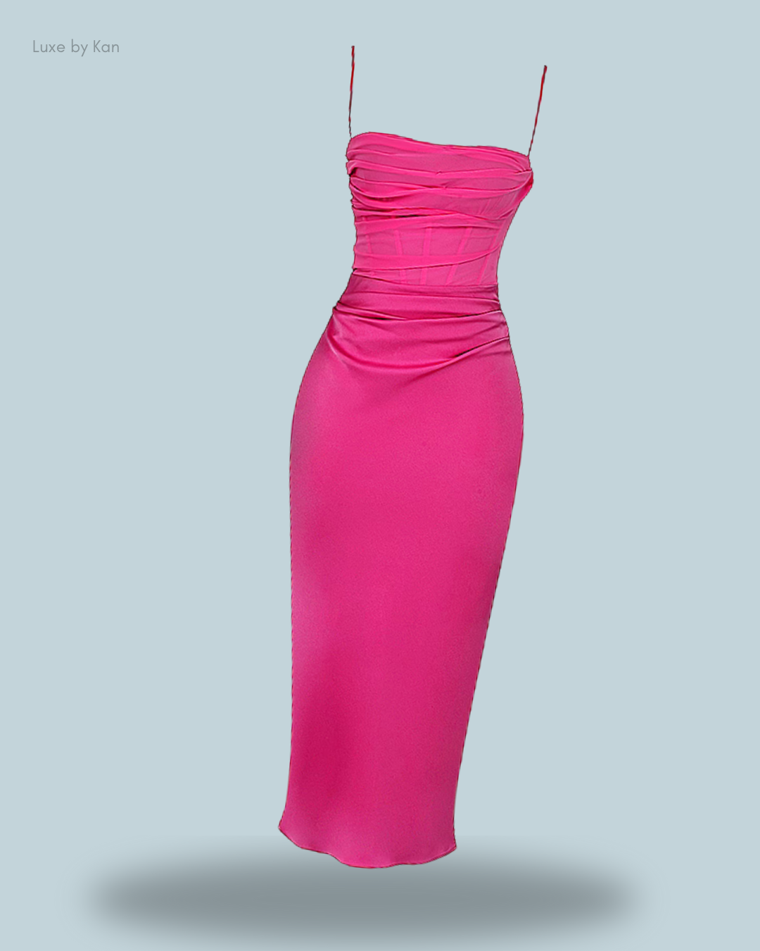 A stylish pink teia draped corset midi dress with spaghetti straps and gathered detailing.