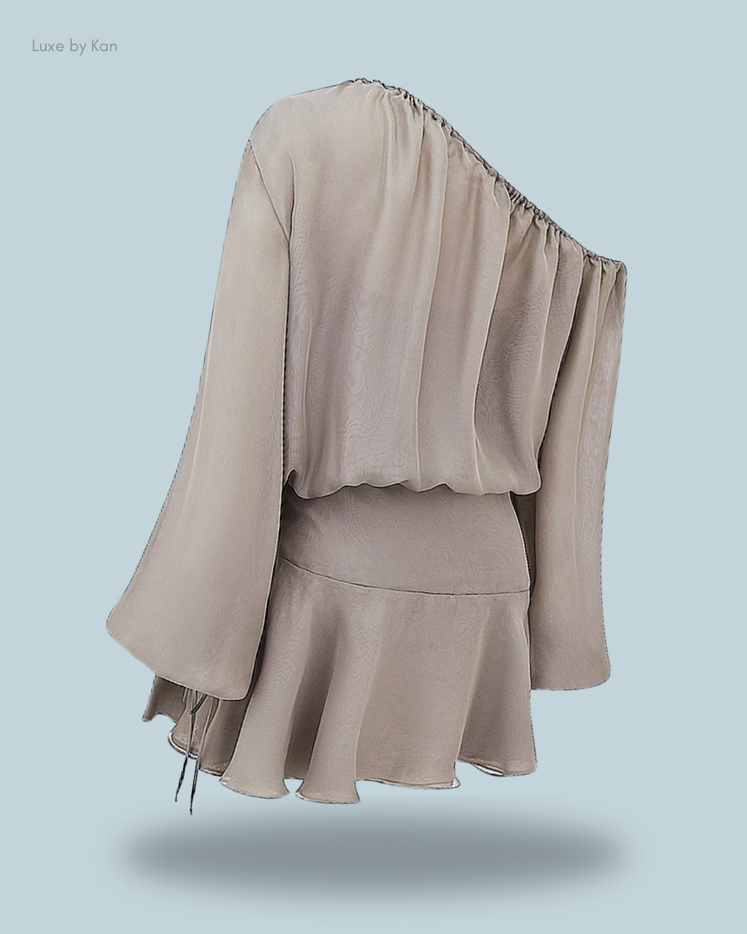 A flowing beige one-shoulder top with wide sleeves and a flared hem.