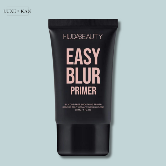 A black tube of Huda Beauty Easy Blur Primer, labeled as silicone-free and for smoothing.