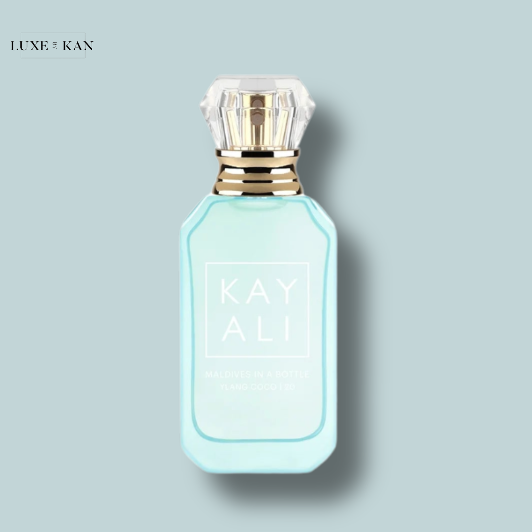 A stylish turquoise perfume bottle labeled "KAYALI Maldives in a Bottle" with a gold-trimmed cap.