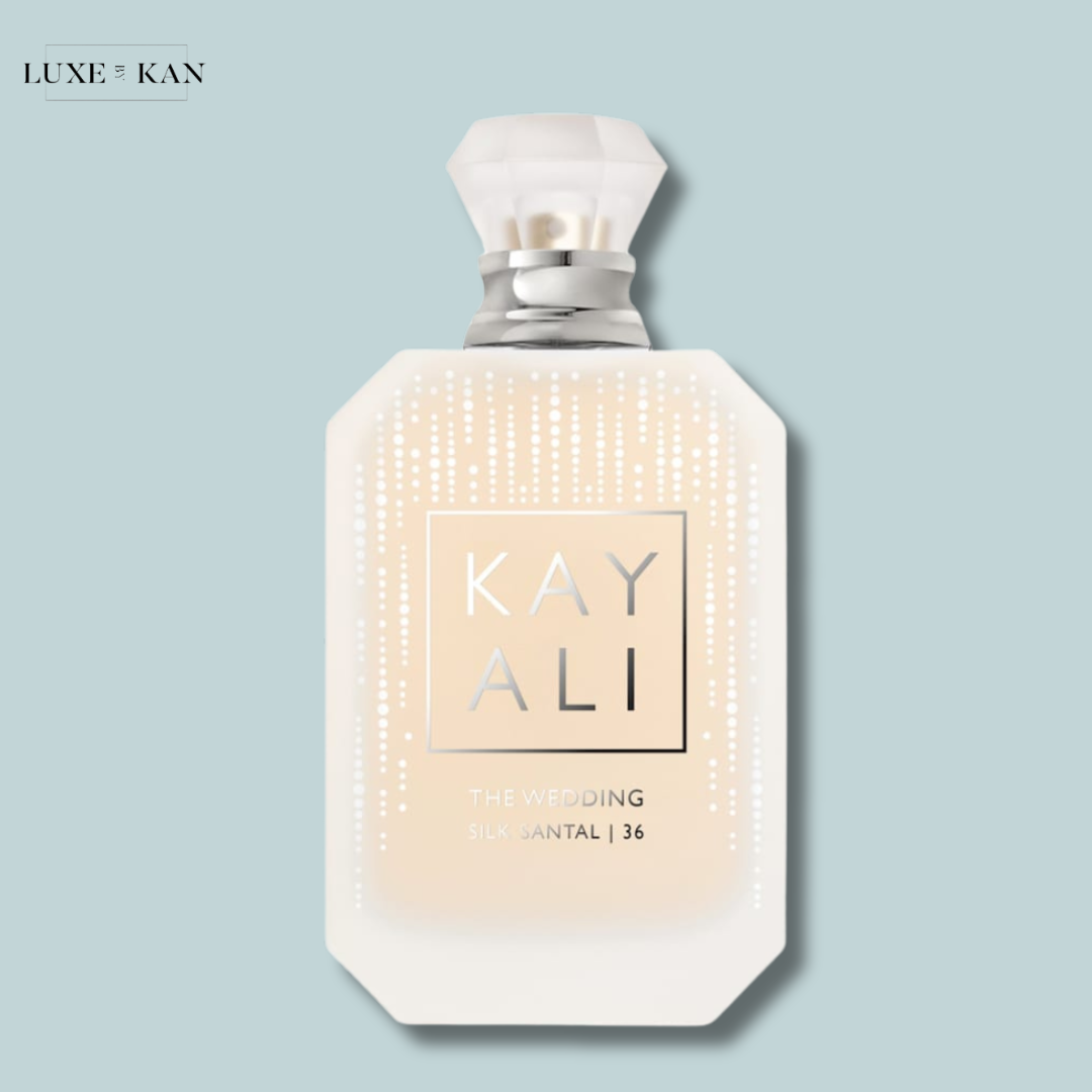 A stylish perfume bottle labeled "KAYALI THE WEDDING SILK SANTAL | 36" with a classy design.