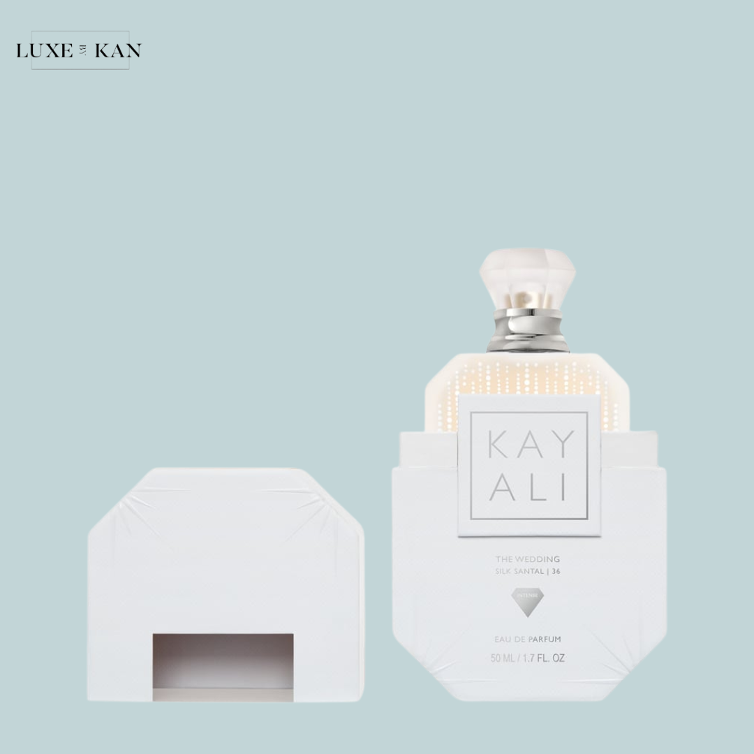 White perfume bottle labeled "KAYALI The Wedding Silk Santal" next to a sleek white box.