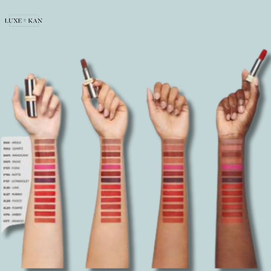 Four diverse arms showcase a range of prada hyper matte monochrome refillable lipstick swatches, highlighting various shades from nude to deep red, with lipsticks held above.