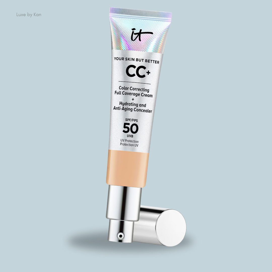 It Cosmetics Your Skin But Better CC+ Cream with SPF 50 in a silver tube with an open pump on a blue solid background.