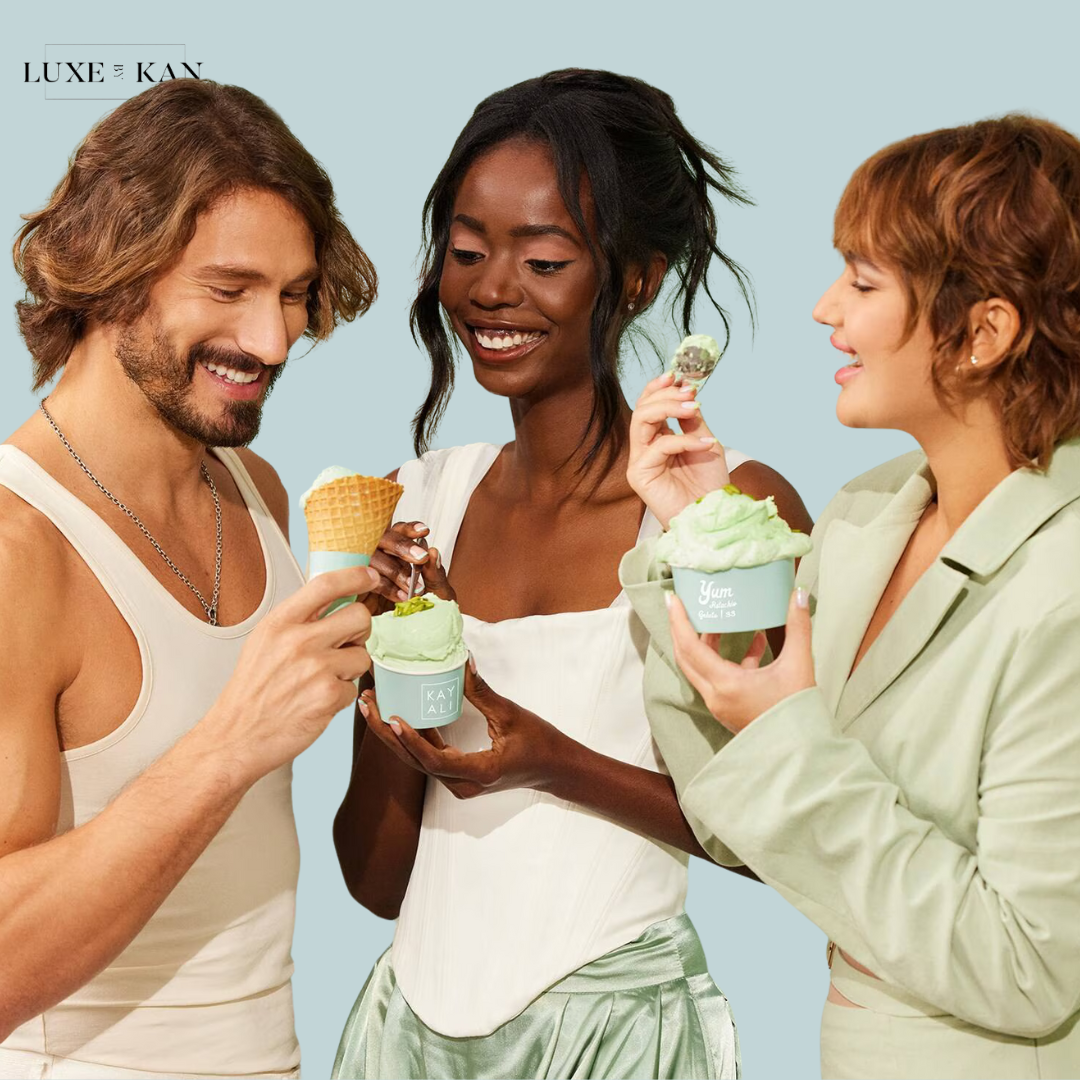 Three friends enjoy mint ice cream, holding cones and cups against a soft blue background. The setting is cheerful and vibrant.