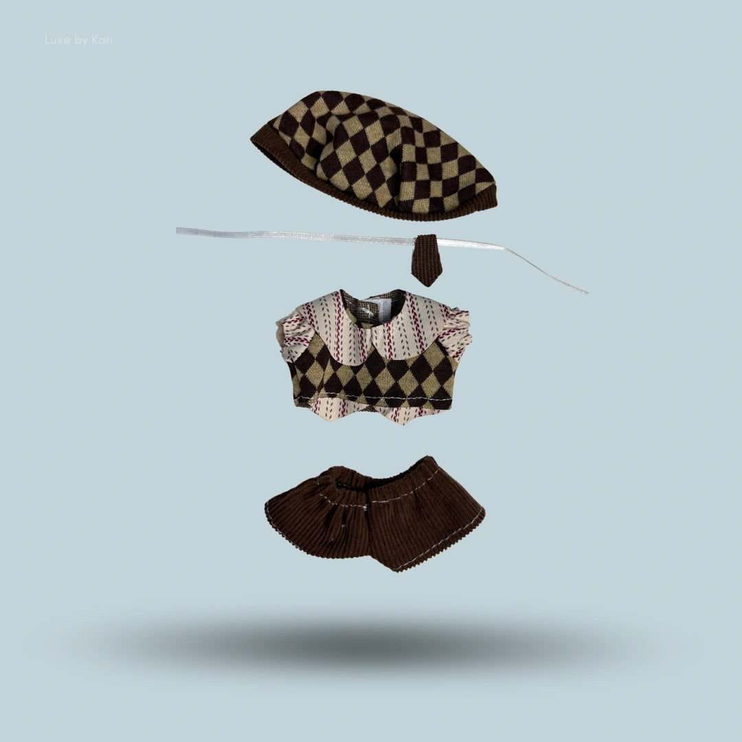 Labubu doll collectible outfit mocha scholar 4 piece set: A brown, diamond-patterned sweater top, matching skirt, beret, and tie.