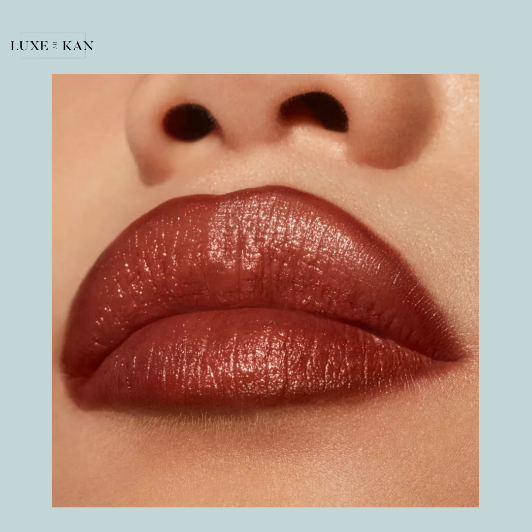 A warm-toned, circular background with a smooth gradient transitioning from light peach to deep coral hues.