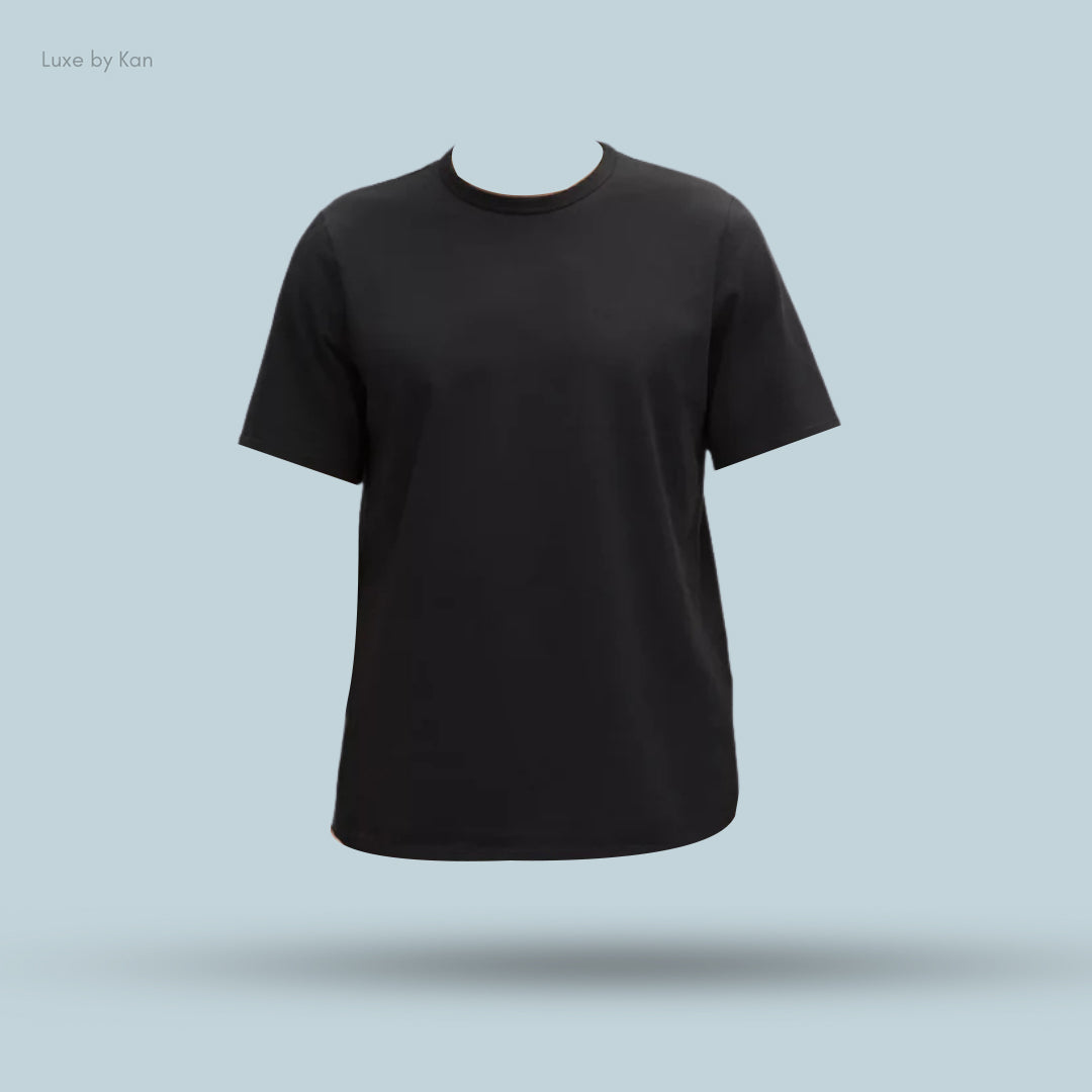 A plain black t-shirt displayed against a light blue background, featuring short sleeves and a classic crew neckline.