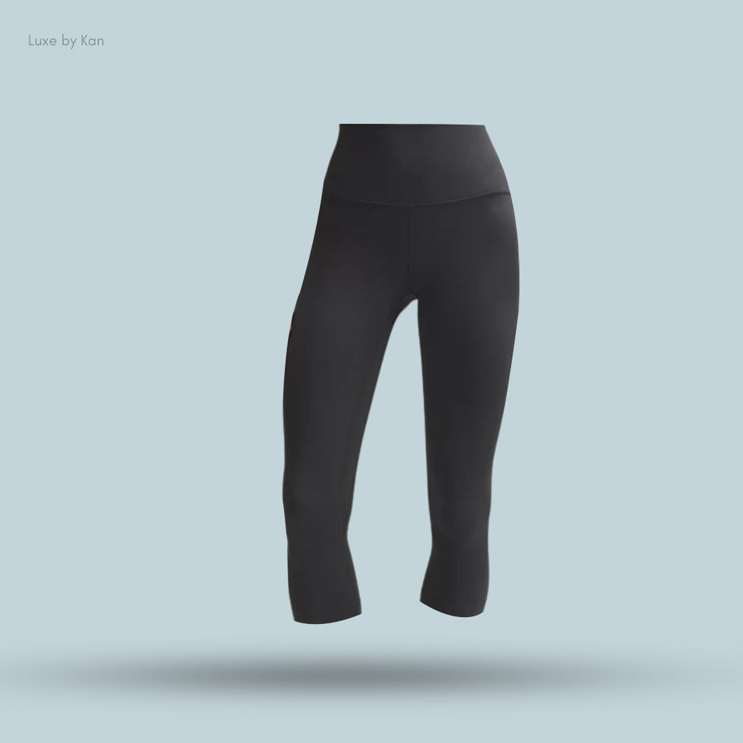 Black cropped leggings, featuring a high waistband for comfort and flexibility.