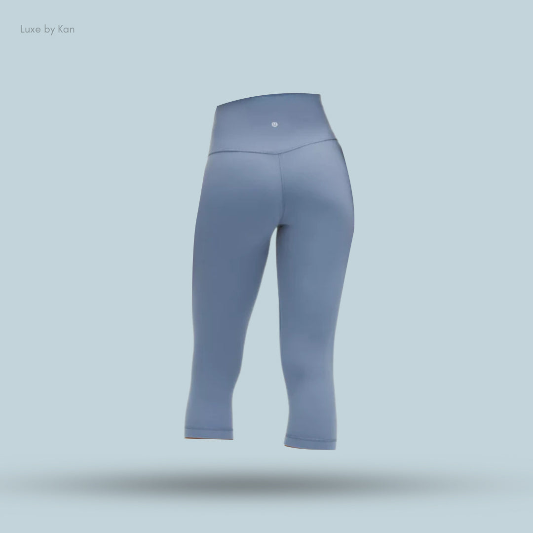 Light blue, high-waisted leggings, showcasing a sleek, modern design.
