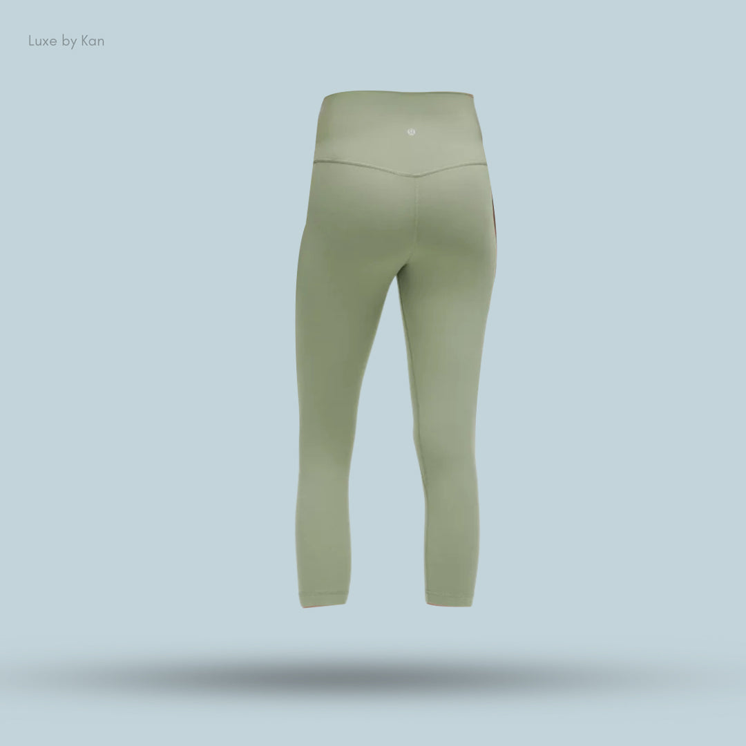 Back view of light green Lululemon Align™ High-Rise Crop 21" leggings, featuring a stretchy fit and high waistband.