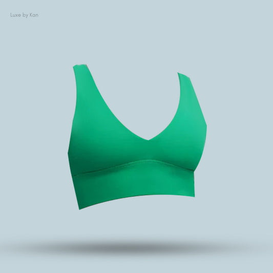 A vibrant green sports bra with a V-neckline and wide straps.