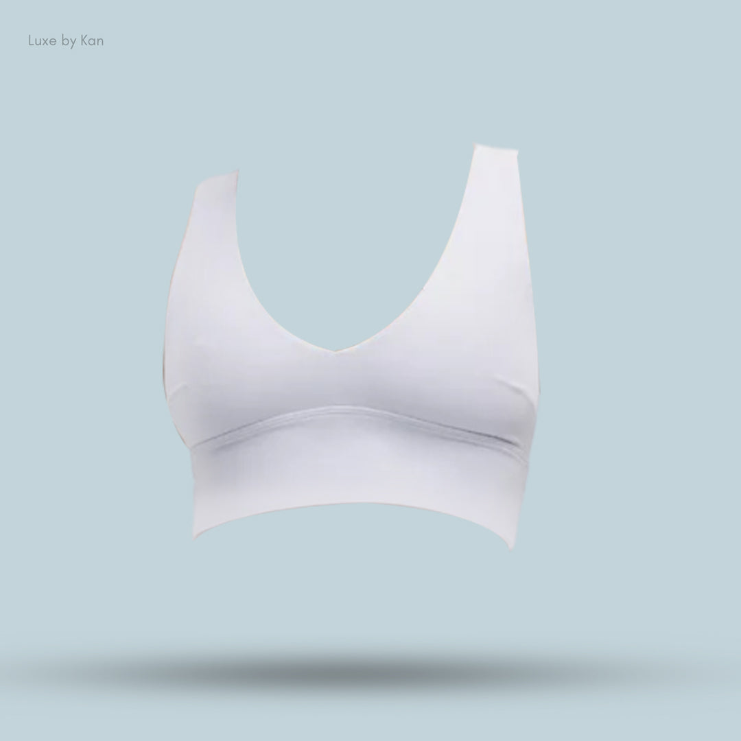A sleek, white women's bralette with a deep V-neck design.