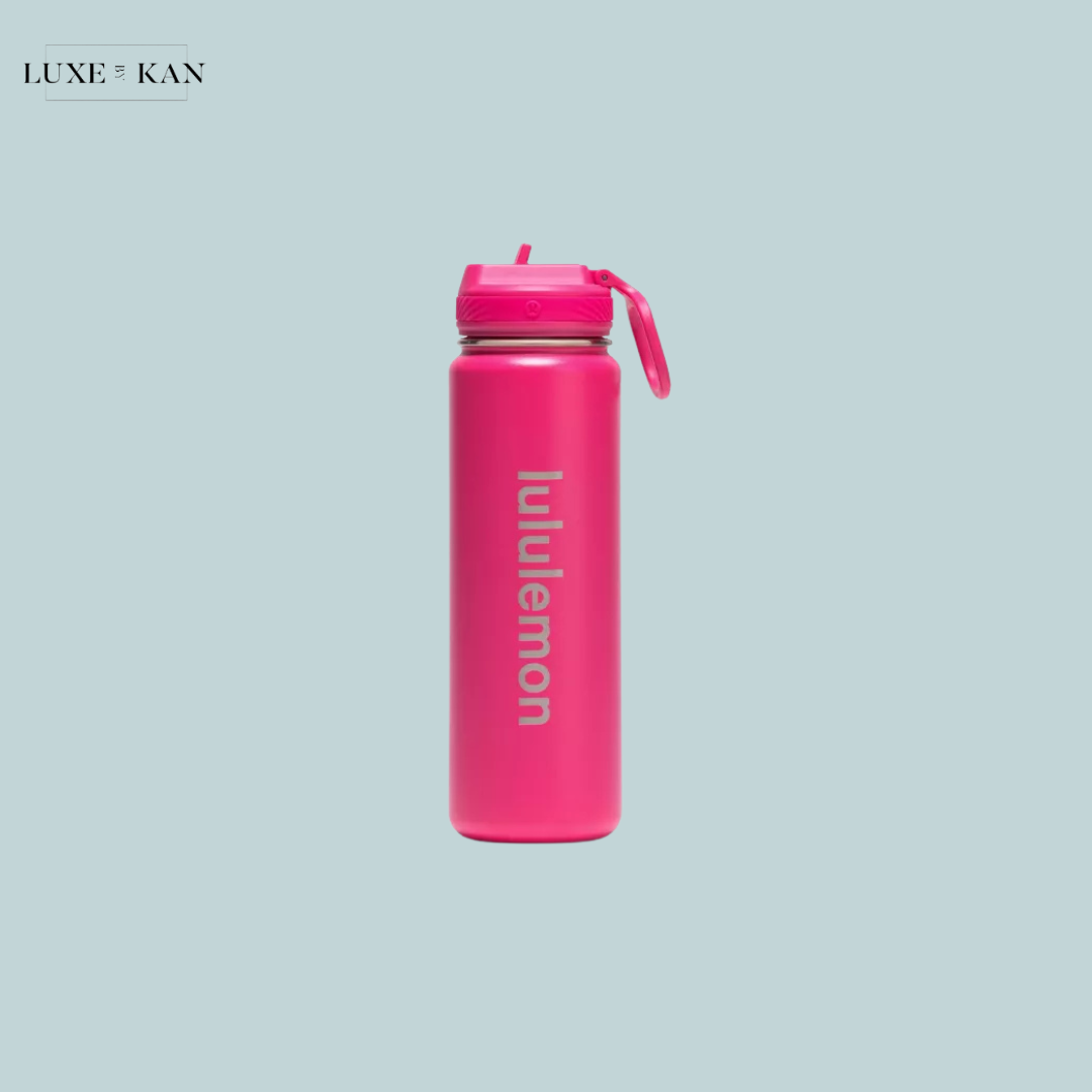 A vibrant pink Lululemon back to life sport water bottle 24oz with a straw lid.