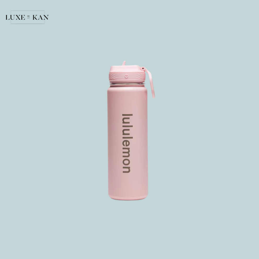 A pink Lululemon water bottle featuring a sleek design and a flip-top lid.