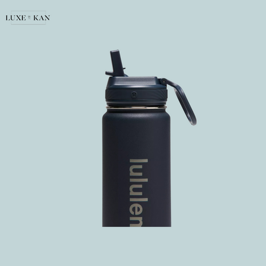 A sleek navy blue water bottle with a flip-top lid, featuring the "lululemon" logo prominently displayed.