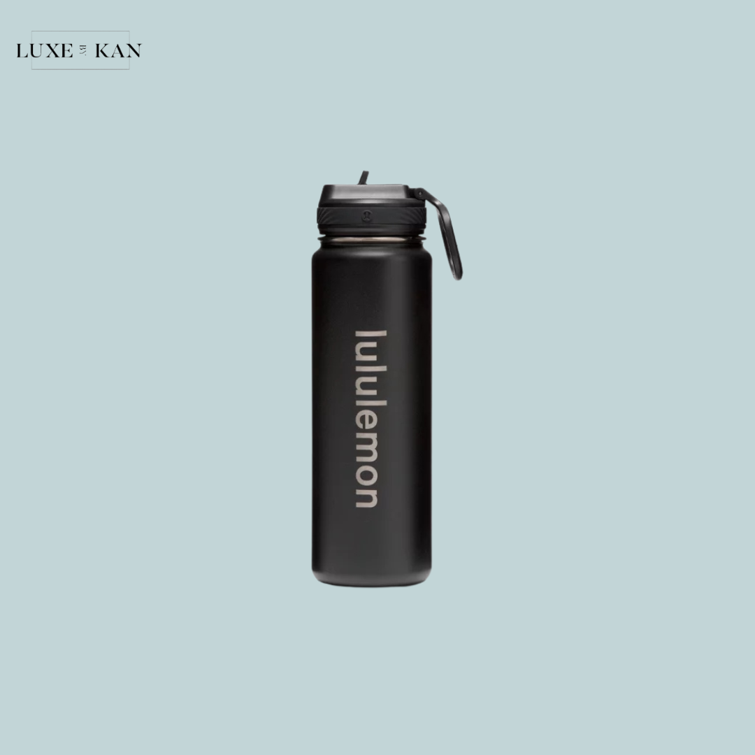 A sleek black Lululemon water bottle with a flip-top lid.