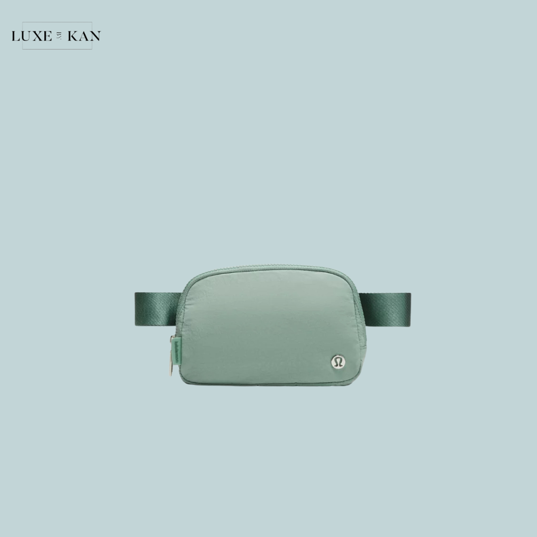 A mint green Lululemon Everywhere Belt Bag featuring a sleek design and a small logo.