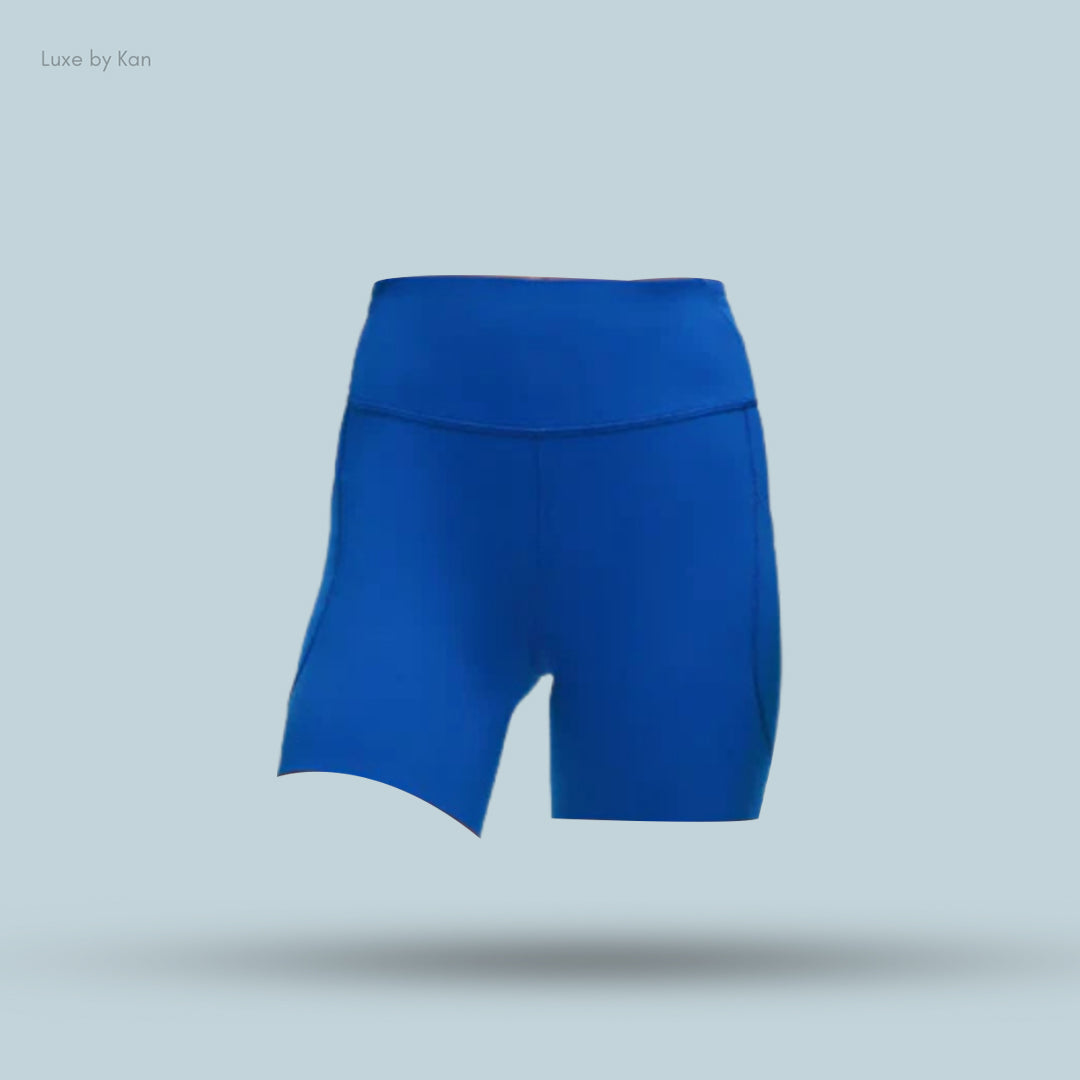 Bright blue athletic shorts with a high waistband, designed for comfort and performance against a light blue background.