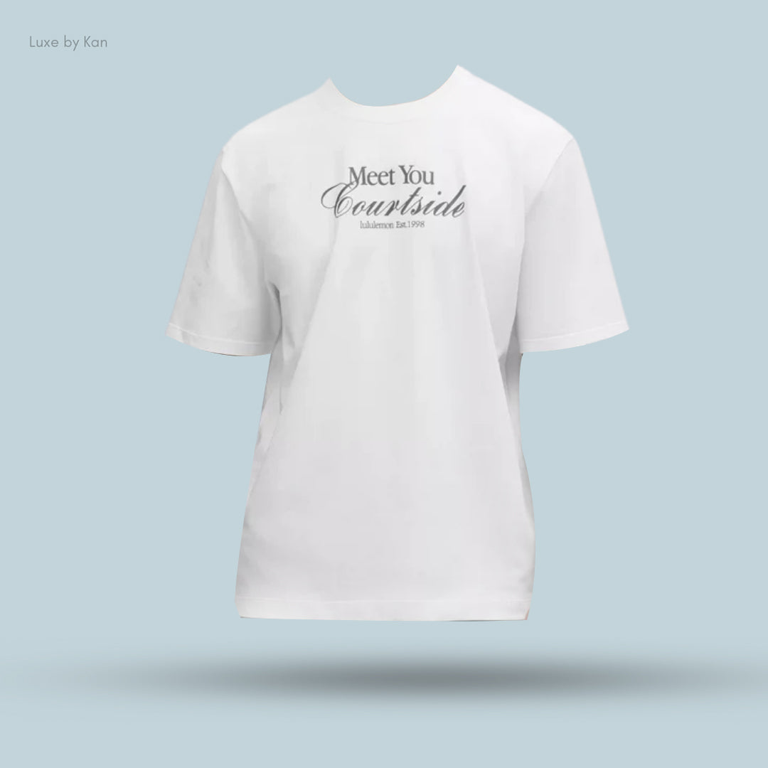A white heavyweight cotton jersey Tennis Club T-shirt displaying the text “Meet You Courtside” with “Lululemon Est. 1998” below.