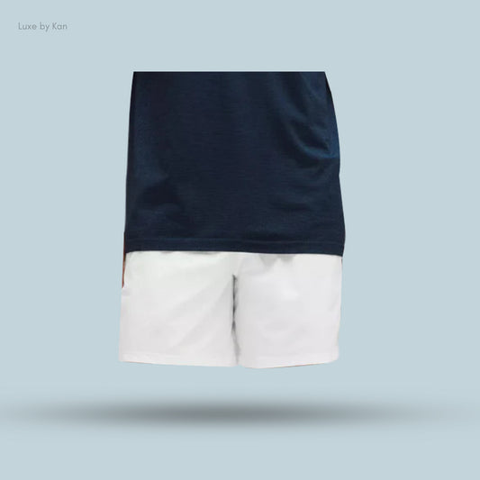 A navy blue t-shirt paired with white Pace Breaker Linerless 7" Shorts, showcasing a casual, stylish look.