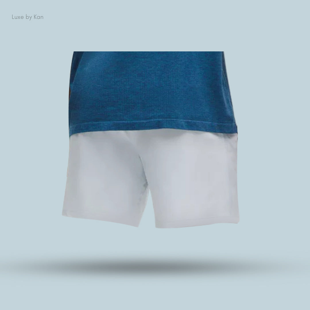 A blue t-shirt paired with white Pace Breaker Linerless 7" Shorts, showcasing a stylish casual outfit.