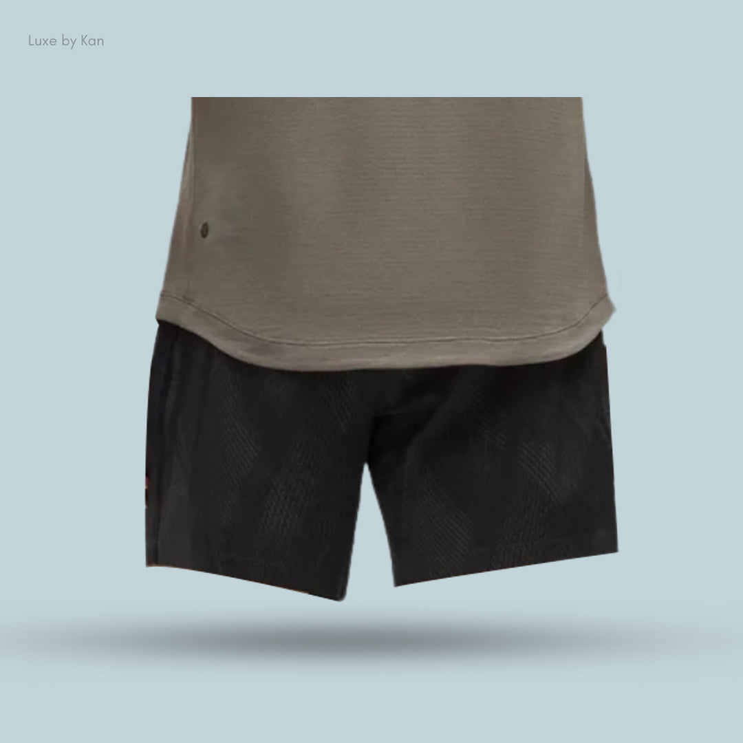A close-up of a gray textured shirt paired with light gray shorts.