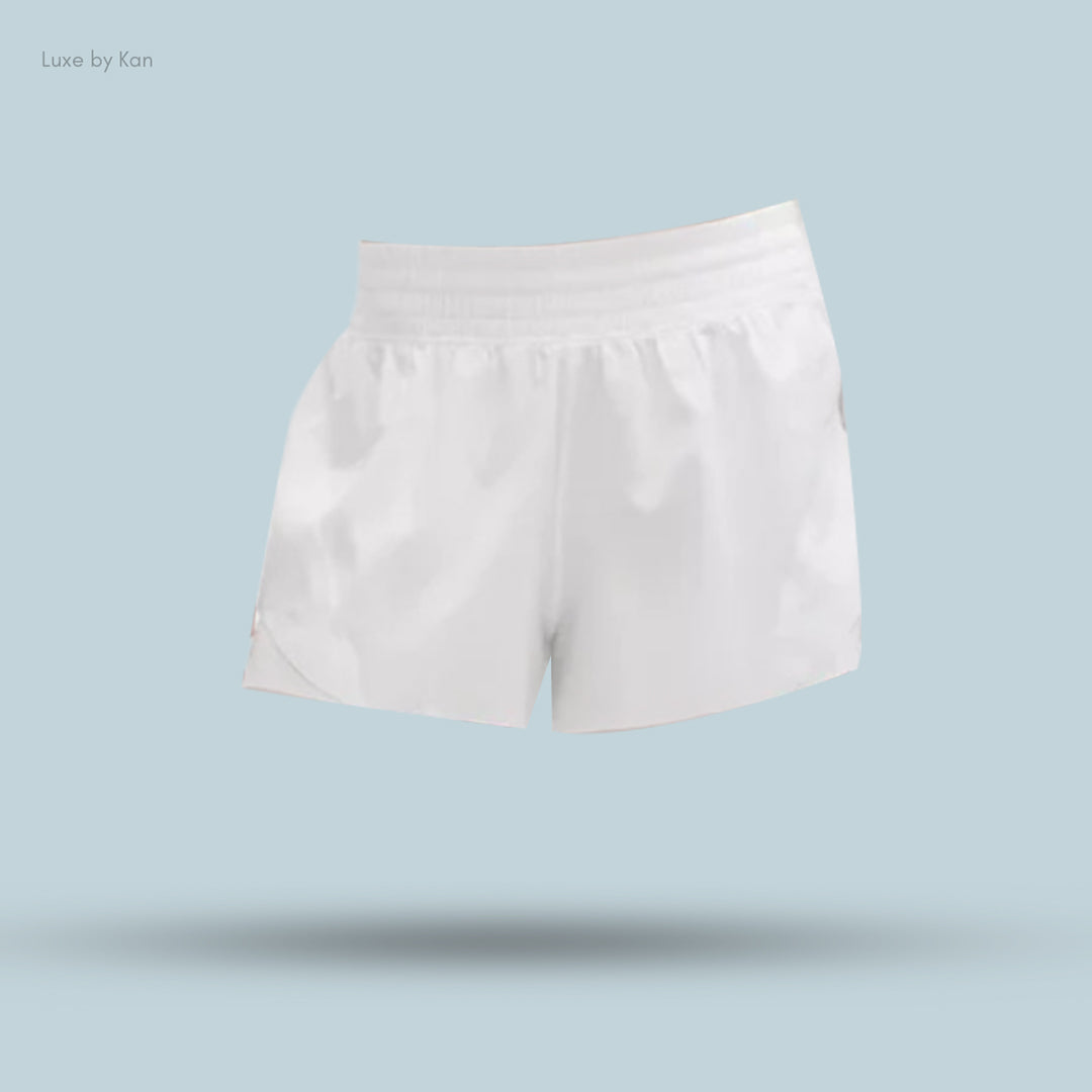White satin athletic shorts with an elastic waistband, showcasing a minimalist design.